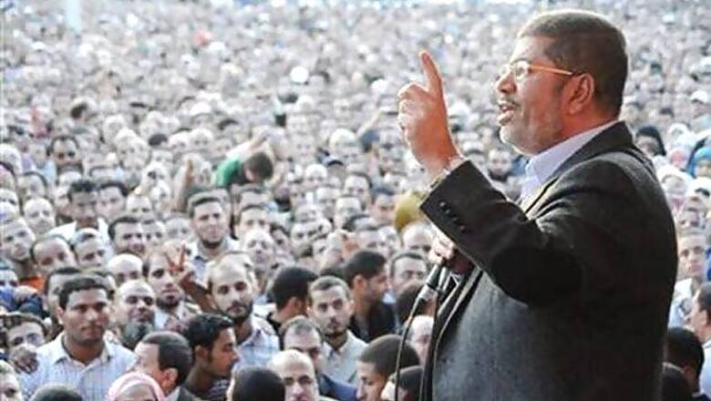 Egypt's president stands by his decrees