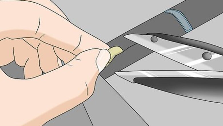 How to Sew a Button on Pants