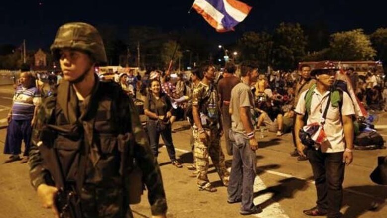 Thai army chief summons ousted PM for talks a day after coup