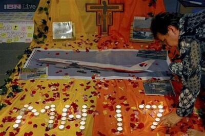 A day after, faces of doomed Malaysian plane crash victims emerge