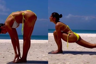 Kubbra Sait Looks Smoking Hot In A Yellow Bikini Set As She Practises Yoga On A Serene Beach; Watch