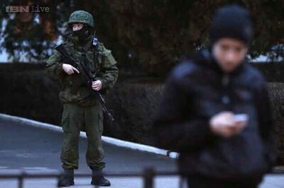 Armed men seize two airports in Ukraine's Crimea, Yanukovich reappears