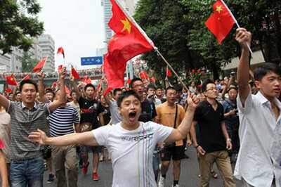 Japan activists land, raise flags on disputed isle