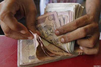 Rupee trims initial losses vs dollar
