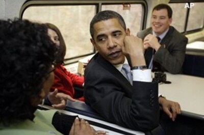 Obama takes a train to New York, draws cheers