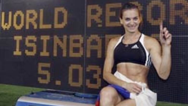 Russia's Isinbayeva pole vaults to a new world record