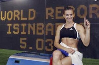 Russia's Isinbayeva pole vaults to a new world record