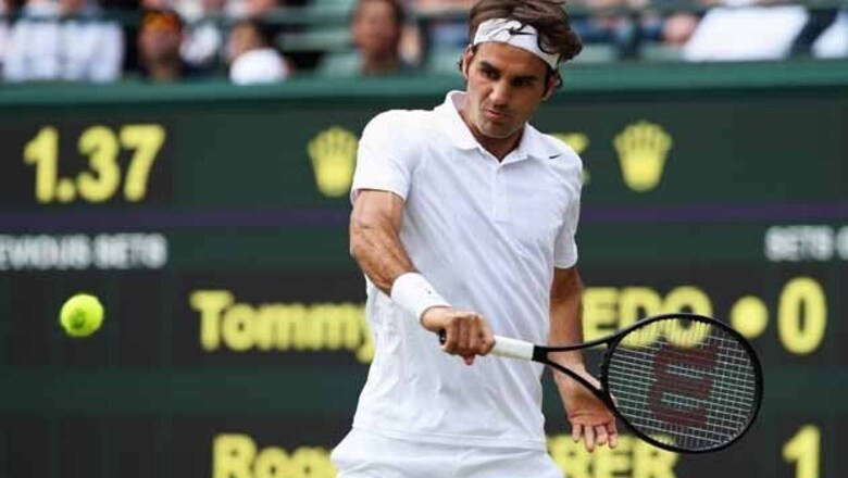 Federer eases into Wimbledon quarters