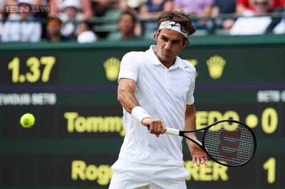 Federer eases into Wimbledon quarters