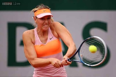 Sharapova grinds down Stosur to reach French Open last eight