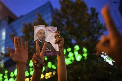 Iranians revel as new president hails 