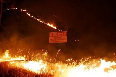 Two die fighting California lightning fires, tens of thousands flee