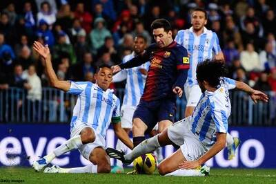 Barca wary of Malaga but Real almost in Copa semis