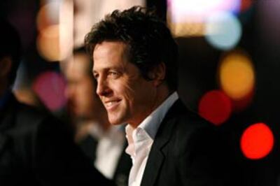 Hugh Grant kicks paparazzi lensman in the groin