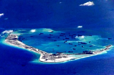 Philippines Verifying Photos of China Military Aircraft on Reef