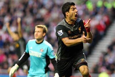 Suarez rescues a point for Liverpool