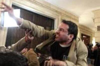 Sentence reduced for journo who shoe-attacked Bush