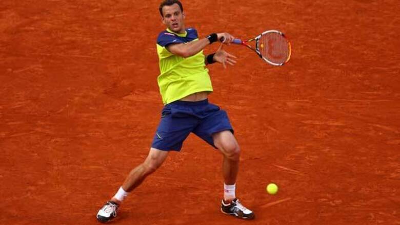 Mathieu outlasts Isner in marathon five sets