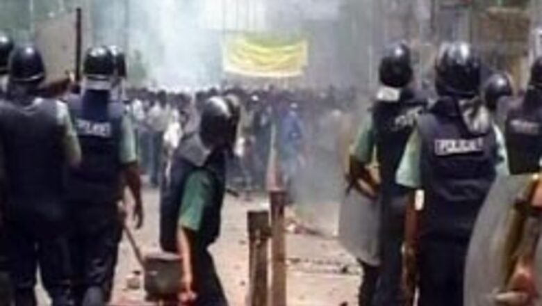Workers burn factories in Dhaka