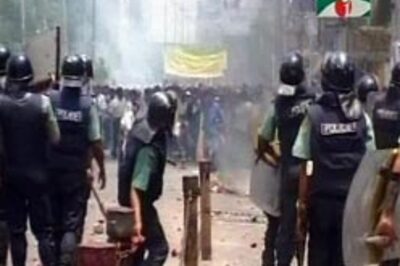 Workers burn factories in Dhaka
