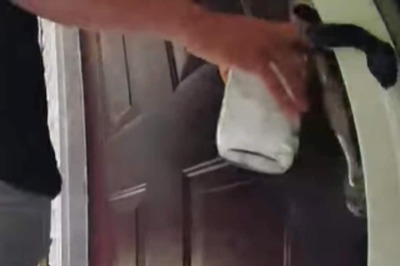 Snake Coiled Around Door Handle Attacks Man In This Scary Video