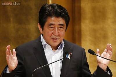 Japan PM Shinzo Abe puts off tax hike, calls snap poll