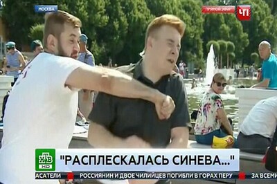 Russian TV reporter Punched in The Face During Live Broadcast