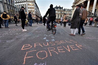 Police hunt suspect after Islamic State kills 30 in Brussels suicide attacks