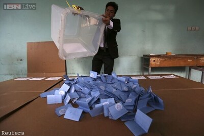 Afghanistan runs out of ballot papers as election turnout surprises
