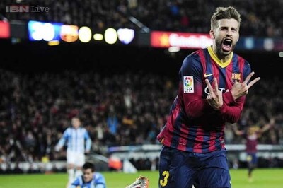 Barcelona ease past Malaga 3-0, reclaim top spot