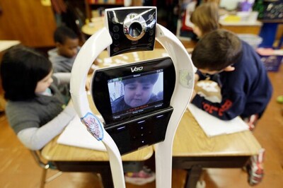 Sitting at home, boy attends school via a robot proxy