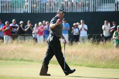 Woods makes solid start, Westwood on the charge