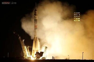 Astronauts board space station for 1-year mission