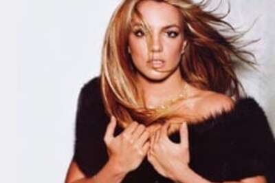 Britney covers up in see-through dress