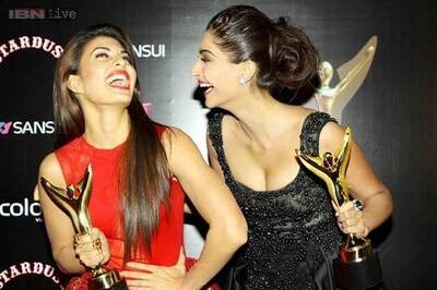 Sonam Kapoor poses with her 'date' Jacqueline Fernandez on the red carpet at the Colors Stardust Awards
