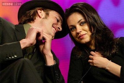 Ashton Kutcher doting on his pregnant fiancee Mila Kunis