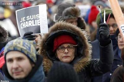 Defiant Charlie Hebdo fronts Prophet Muhammad, drawing more threats